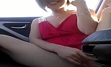 Red dress amateur fucking her juicy pussy in the backseat